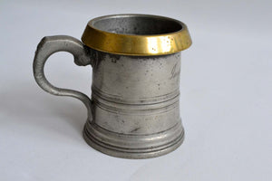 Half Pint Pewter Measure with a Brass Rim