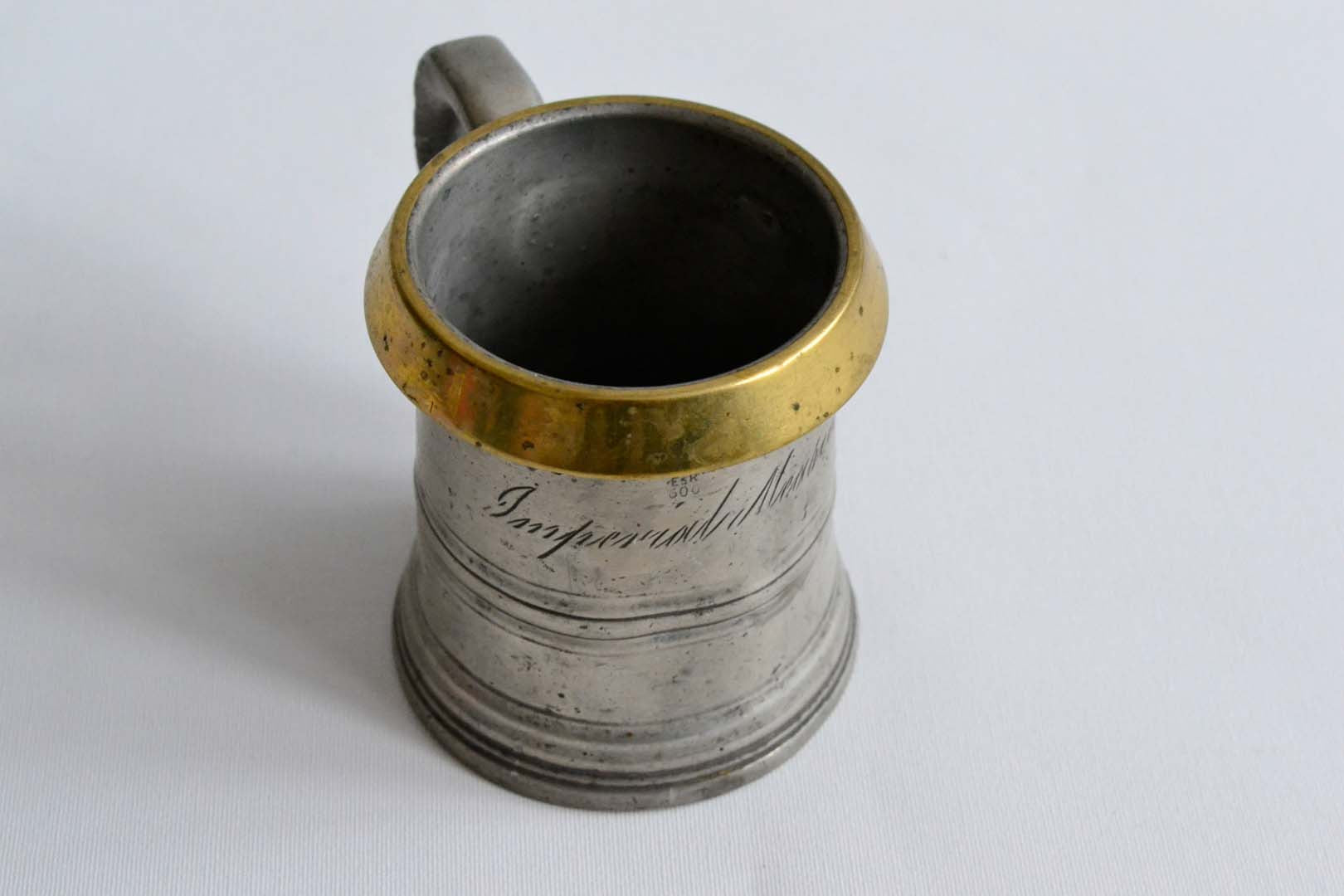 Half Pint Pewter Measure with a Brass Rim