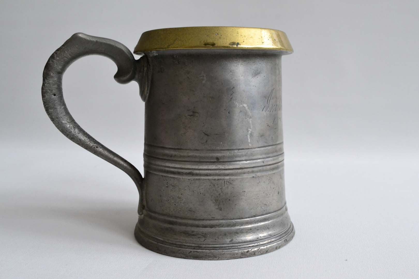 Quart Pewter Measure with a Brass Rim