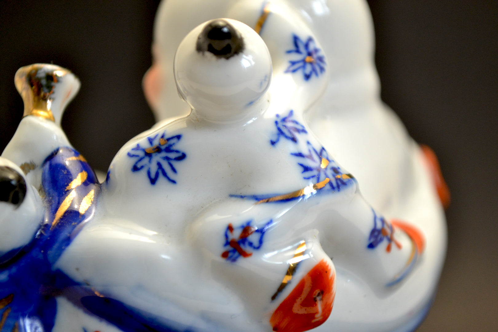 Porcelain Laughing Buddha Figure with Five Children