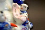 Porcelain Laughing Buddha Figure with Five Children
