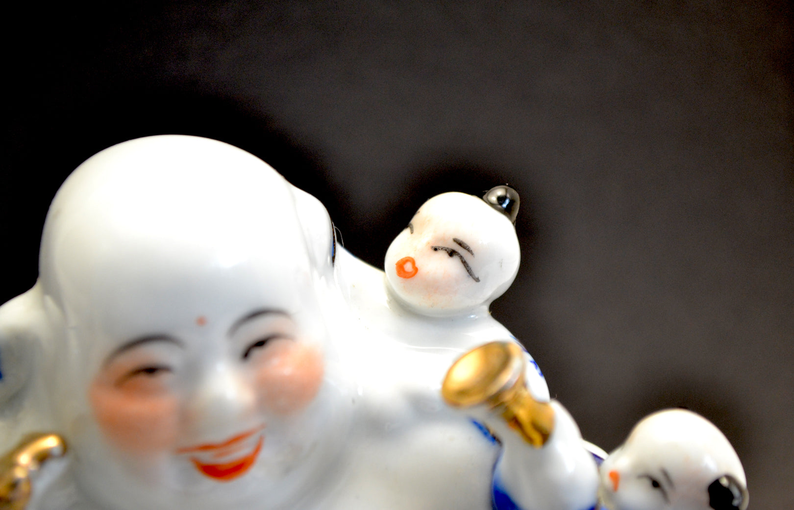 Porcelain Laughing Buddha Figure with Five Children